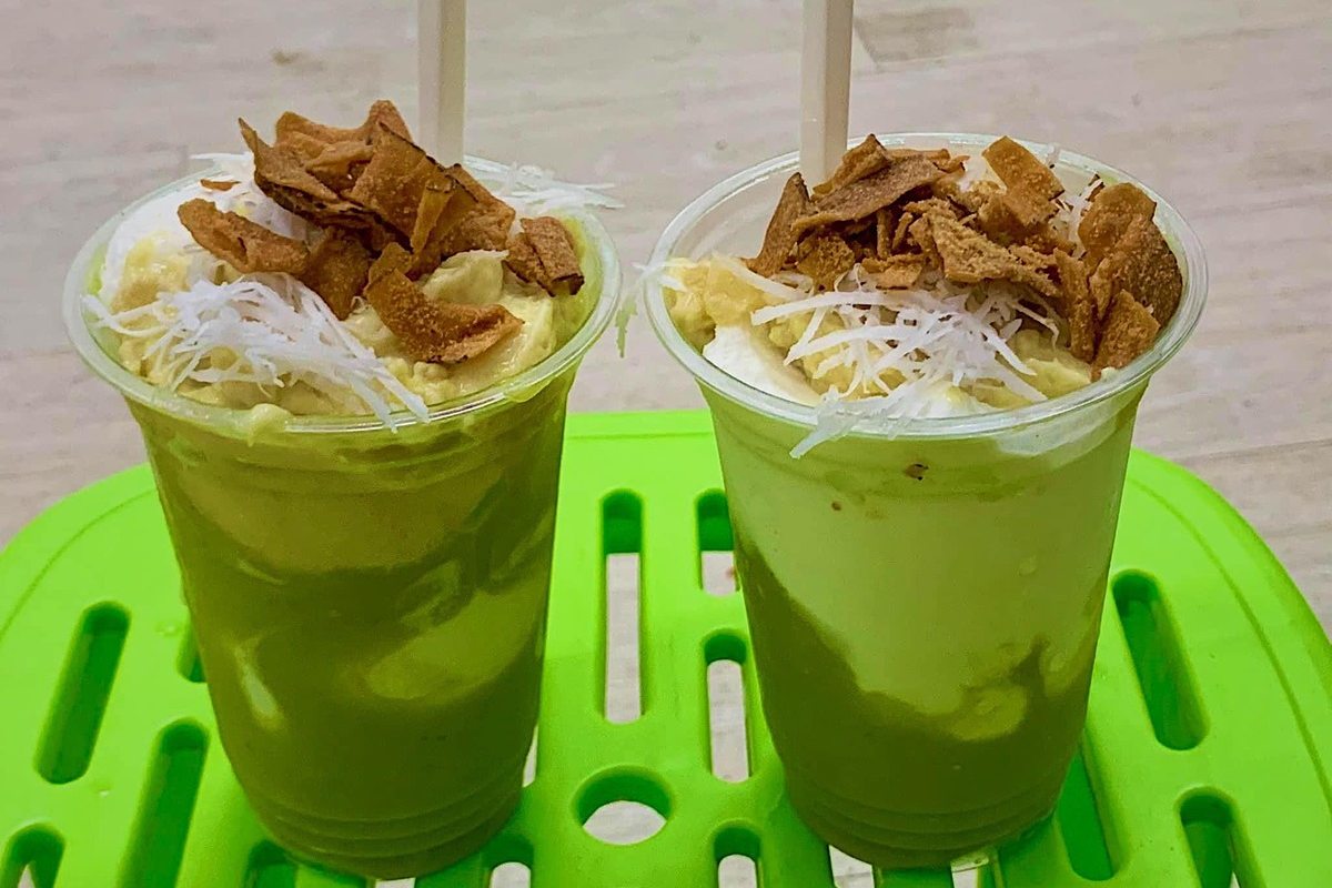A bowl of avocado ice cream topped with coconut flakes